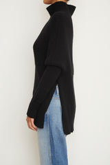 The Matea Cape Long Sleeve Turtleneck Sweater in Black